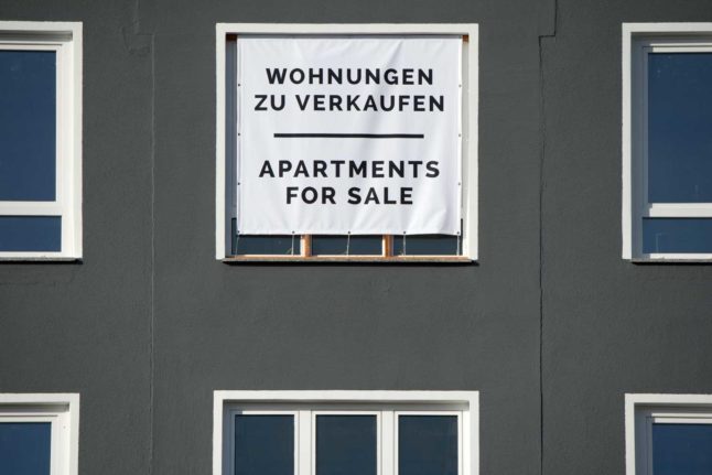 A sign reading 'apartments for sale'. 