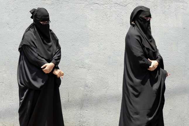 File photo shows two women wearing a burqa