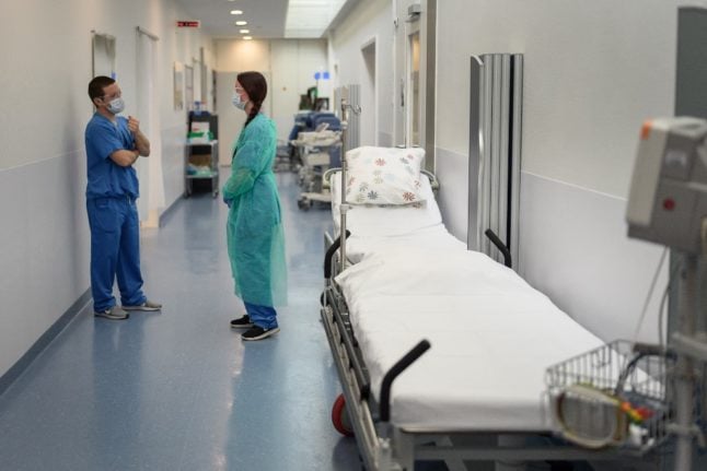 Two medical workers inside a Swiss hospital
