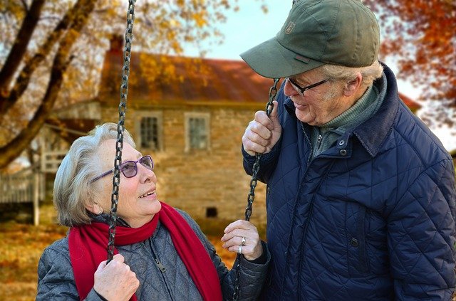 old couple with house