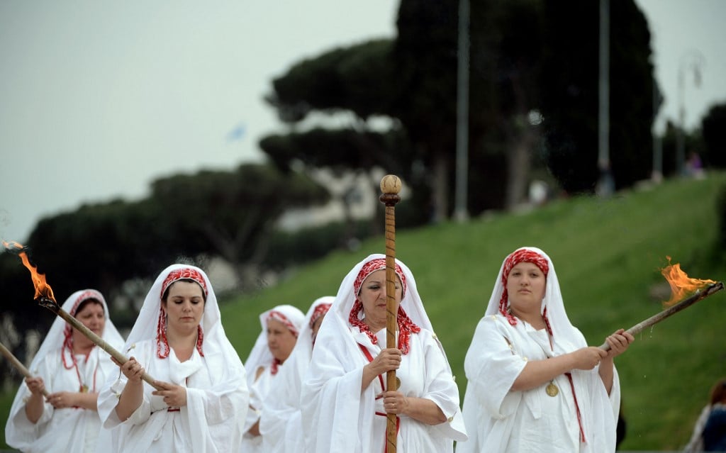 Women dressed as Roman Vestals perform a ceremony to mark Rome's birthday.