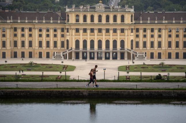 Runners jog in the gardens of Schönbrunn Palace in Vienna, Austria. (Photo by JOE KLAMAR / AFP)
