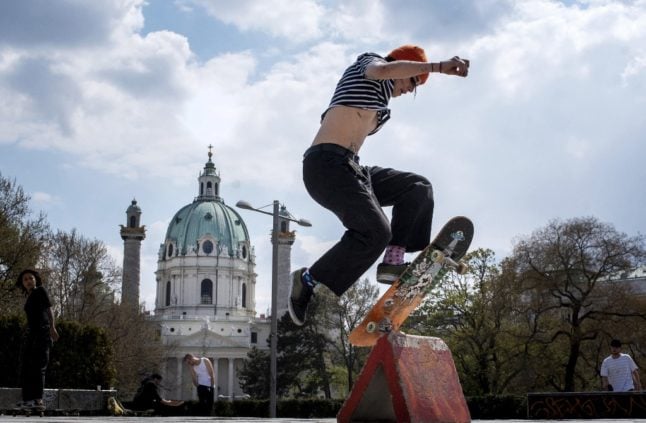 A young woman skateboards at Karlsplatz (Charles' Square) in Vienna. (Photo by JOE KLAMAR / AFP)