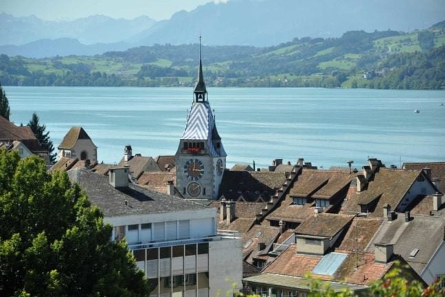 Why are Zug and Schwyz home to the most millionaires in Switzerland?