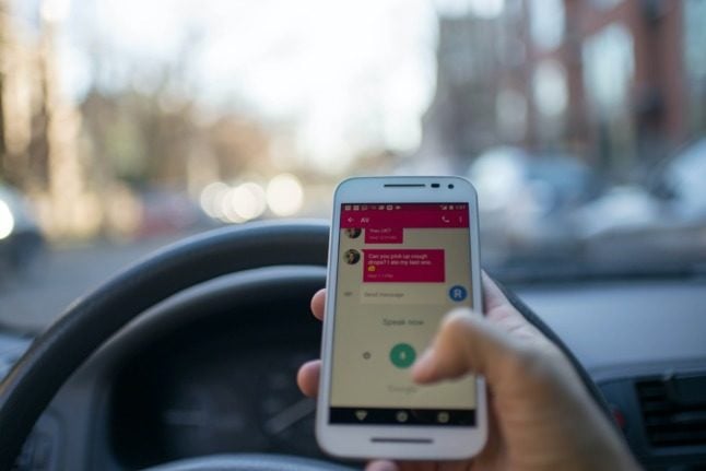 Spain eyes fines for drivers distracted by phones, even if they're not using them