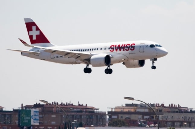 A Swiss Air flight arriving from Zurich, whose passengers will be put in quarantine, prepares to land at the airport in Valencia on May 21, 2020. - Spain has restricted arrivals from Europe's Schengen zone and imposed a mandatory 14-day quarantine period on all travellers to avoid importing new coronavirus cases. (Photo by JOSE JORDAN / STR / AFP)