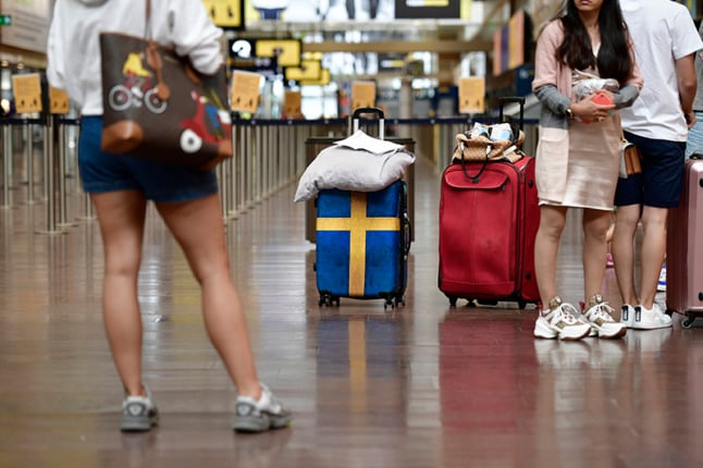 Travellers at Arlanda airport in Stockholm. Photo: Stina Stjernkvist/TT