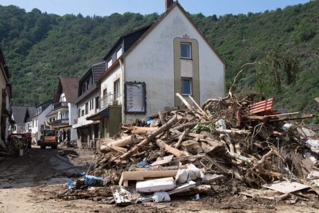 Merkel demands faster climate action as German flood death toll rises                