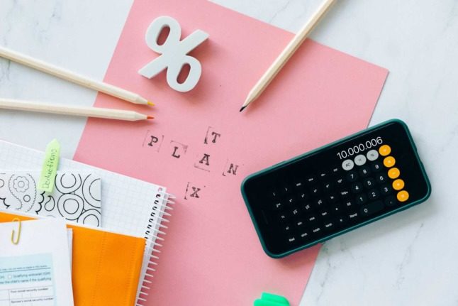 Pencils and paperwork sits on a desk ahead of tax time