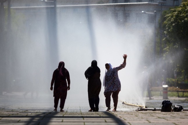 Women by a fountain