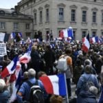 UPDATE: Protesters mass in France against Macron’s Covid health pass