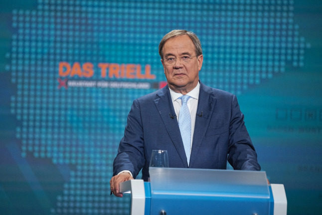 Conservative contender to succeed Merkel goes on attack in TV debate