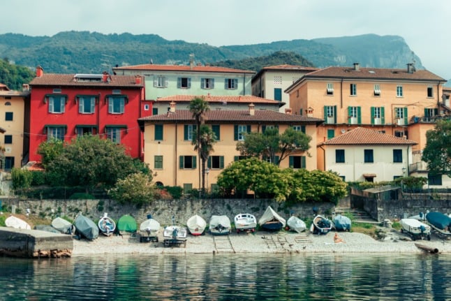 A row of houses by a lake in Lierna, Lecco