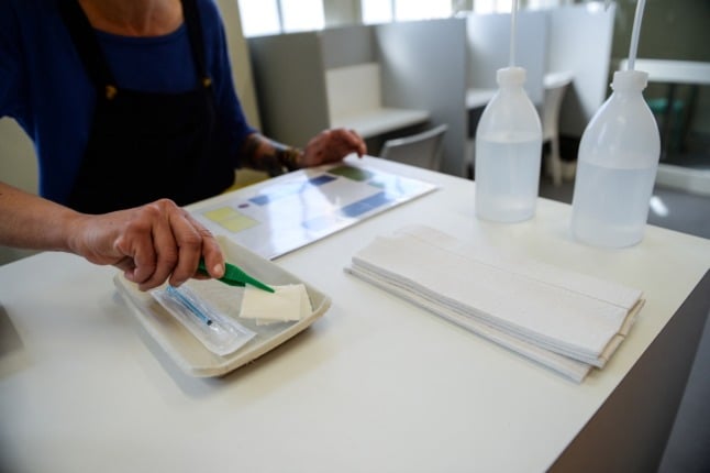 An employee prepares a users' kit at the supervised injection site in Strasbourg, one of two such facilities in France.
