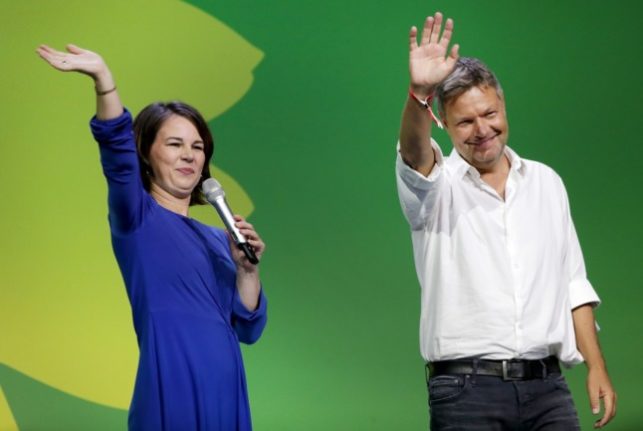 Annalena Baerbock and Robert Habeck, co-leaders of the Greens, wave to supporters at the Greens election party on Sunday after the election.