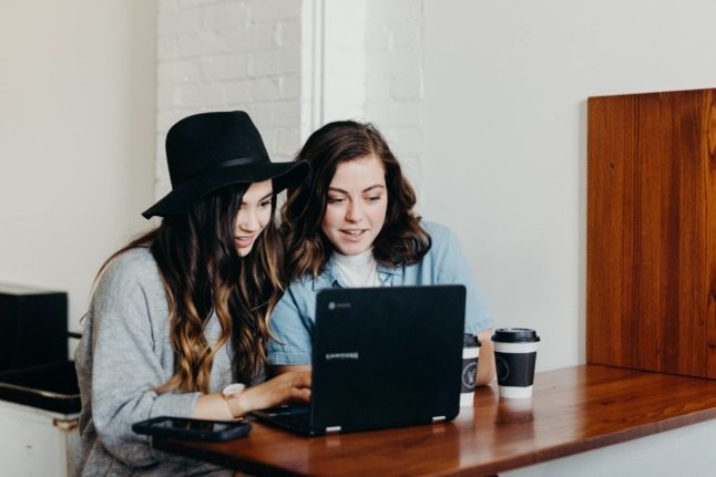 Two women working in a cafe Brooke Cagle on Unsplash