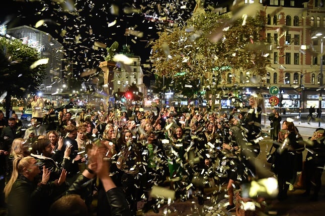 People celebrate the re-opening of nightclubs in central Stockholm