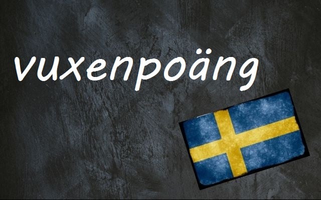 the word vuxenpoäng written on a blackboard with the swedish flag next to it
