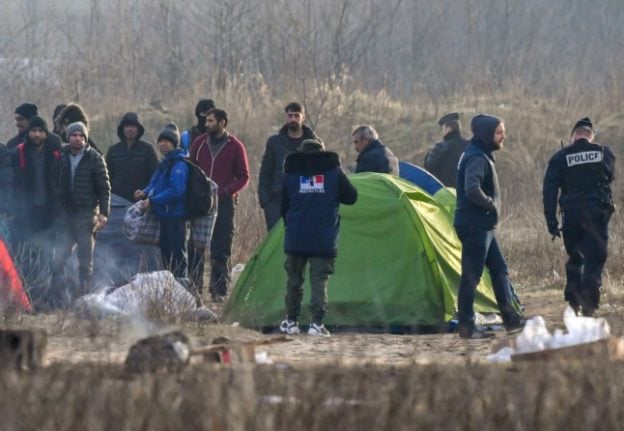 A migrant camp is evacuated by police forces in Calais.