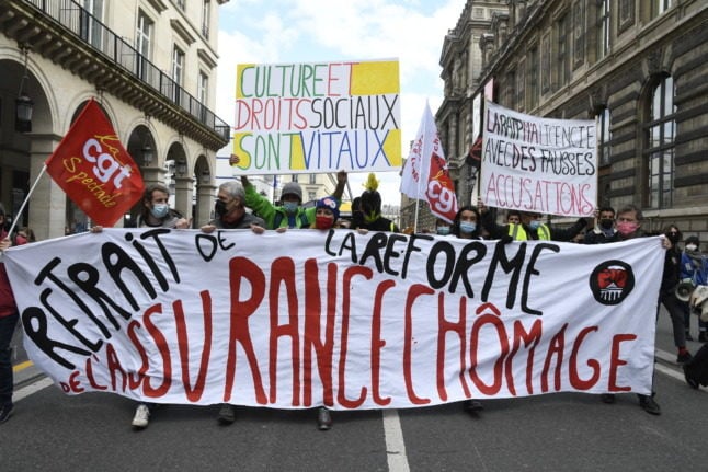 Protesters demand the 'withdrawal of the unemployment insurance reform' in Paris on March 26th.