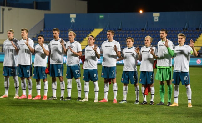 Norway's players pose for a team photo wearing t-shirts showing a pro-human rights slogan ahead of a World Cup Qatar 2022 qualification match. The Nordic nation's senior economic crime investigator on October 28th called for a boycott of the Qatar finals.