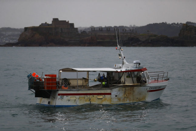 A French fishing boat protests in front of the port of Saint Helier off the British island of Jersey in May 2021. Jersey is once again at the centre of a row over fishing licences.