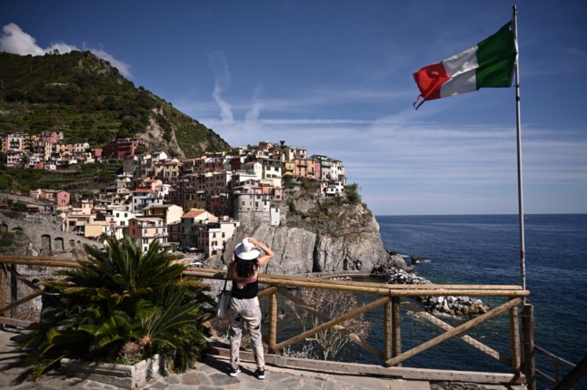 A woman admires the view of Manarola in Italy's Cinque Terre.