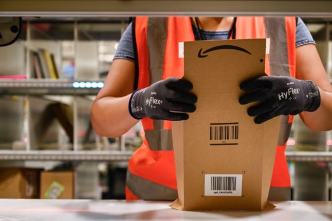 An Amazon employee prepares an order in Augny, France. Amazon will no longer be able to charge one centime for delivering books.