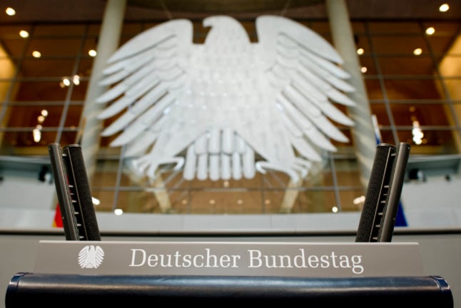The German Federal Eagle is seen behind the podium at the Bundestag in Berlin