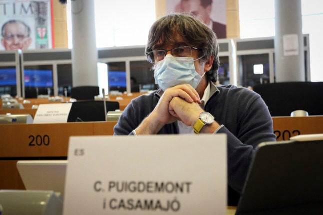 Exiled former Catalan president Carles Puigdemont attends the European Parliament's Committee on International Trade (INTA) in Brussels