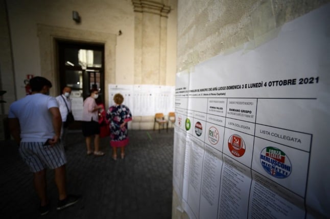 Voters wait at a polling station to vote in the municipal elections in Rome.