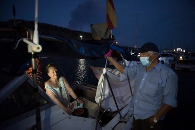 On a tiny boat, elderly couple find safe haven from La Palma's volcano