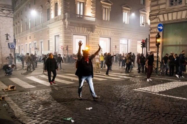 Demonstrators on the streets of Rome on Saturday night protesting the expansion of Italy's Covid-19 green pass system.