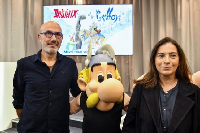 French writer Anne Goscinny (R) with ‘Asterix’ (C) and French writer and designer Jean-Yves Ferri