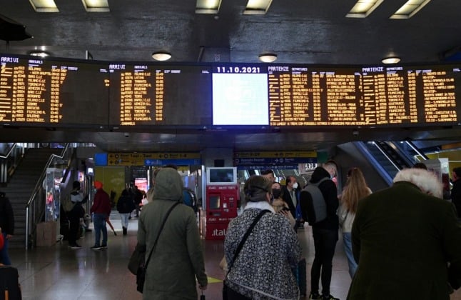 Arrival and departure boards show delayed and cancelled trains at Rome Termini station on October 11th during a general strike.