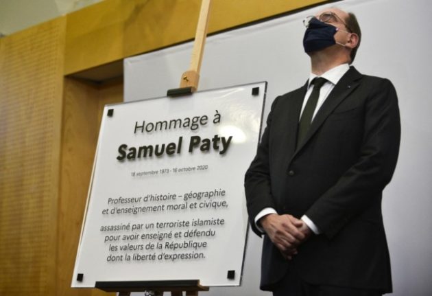 French Prime Minister Jean Castex stands during the unveiling of a memorial plaque at the French Education ministry in Paris