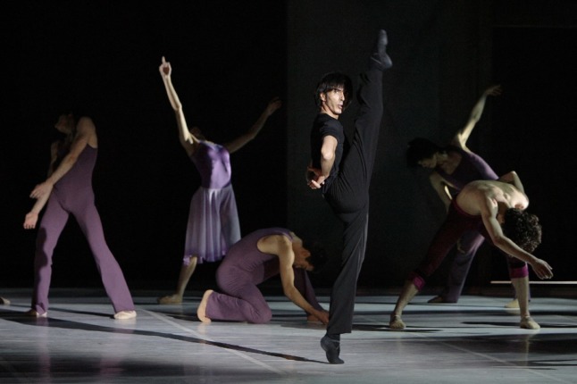 Artistic Director of the Ballet Bejart Lausanne, Gil Roman, pictured with his dancers on stage.