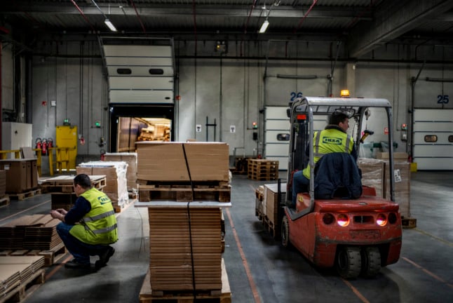 Employees work at an IKEA warehouse in Saint-Quentin-Fallavier. IKEA France has reported problems getting products to its shelves.