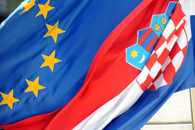 A Croatian flag and a European Union (EU) flag