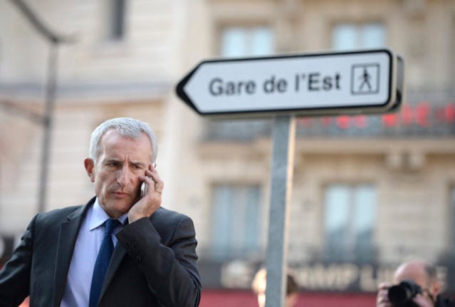 A sign points the way to Gare de l'Est in Paris. City Hall has decided to tear down its old road signs.