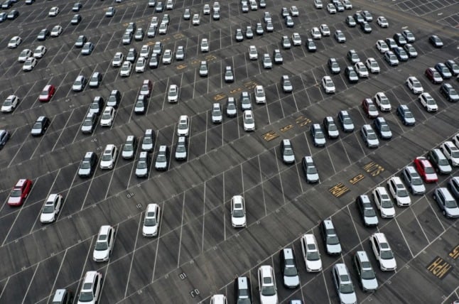 cars at dealership aerial view