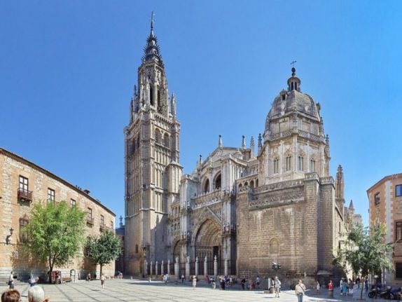 view of the Cathedral of Toledo (Catedral de Santa María de Toledo or, Catedral Primada de Toledo) and to the left the Archbishop's Palace of Toledo