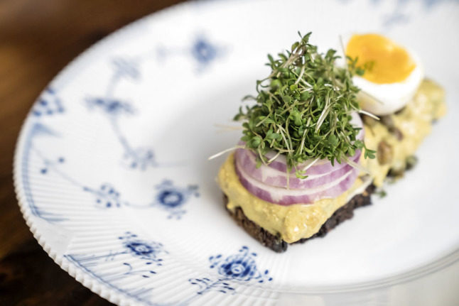 Curried herring with egg and cress on rye bread is a Danish classic.