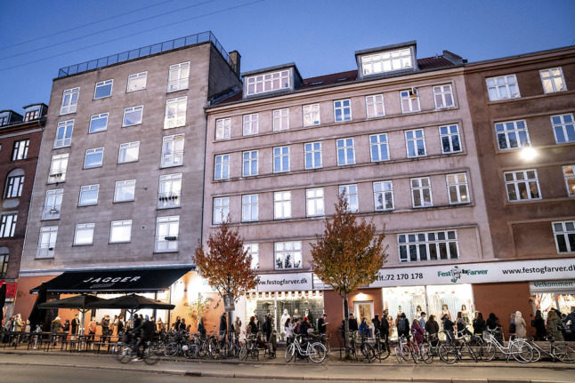 People queue to buy Halloween supplies in Copenhagen on Thursday.