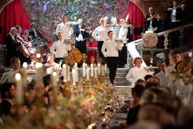 Waiting staff serve guests at the glittering prize ceremony and banquet held in Stockholm for the science and literature laureates will not happen this year due to the pandemic. The banquet will not take place this year. 
