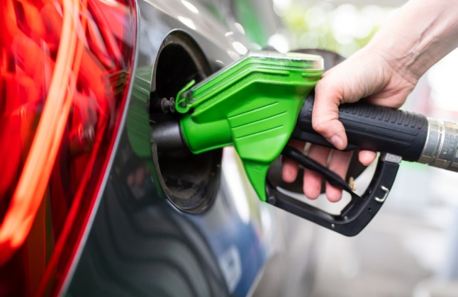 A driver fills up a car at a petrol station in Munich.