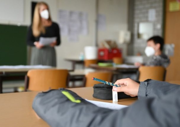 A teacher talks to a class at a school in Baden-Württemberg. Berlin - like much of Germany - is facing a teaching shortage.