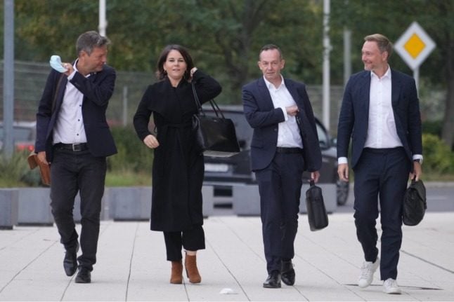 The Greens' Robert Habeck and Annalena Baerbock with the FDP's Volker Wissing and Christian Lindner put on a united front during initial coalition talks earlier in October.
