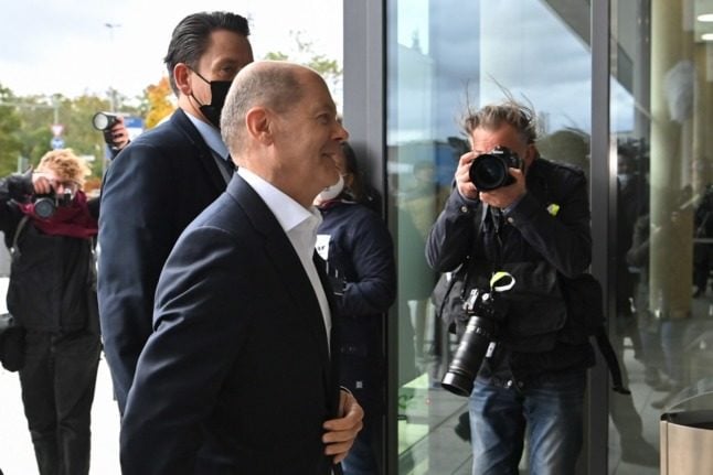 SPD chancellor candidate Olaf Scholz arrives at coalition negotiations in Berlin on Thursday.