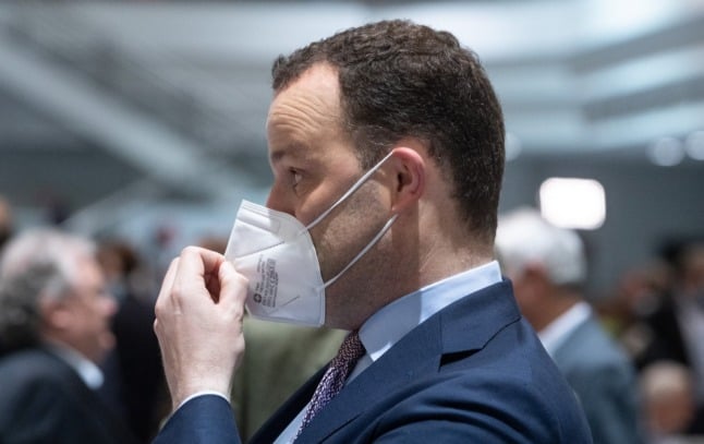 Health Minister Jens Spahn adjusts his FFP2 mask during the North Rhine-Westphalia CDU state party conference on Saturday. 